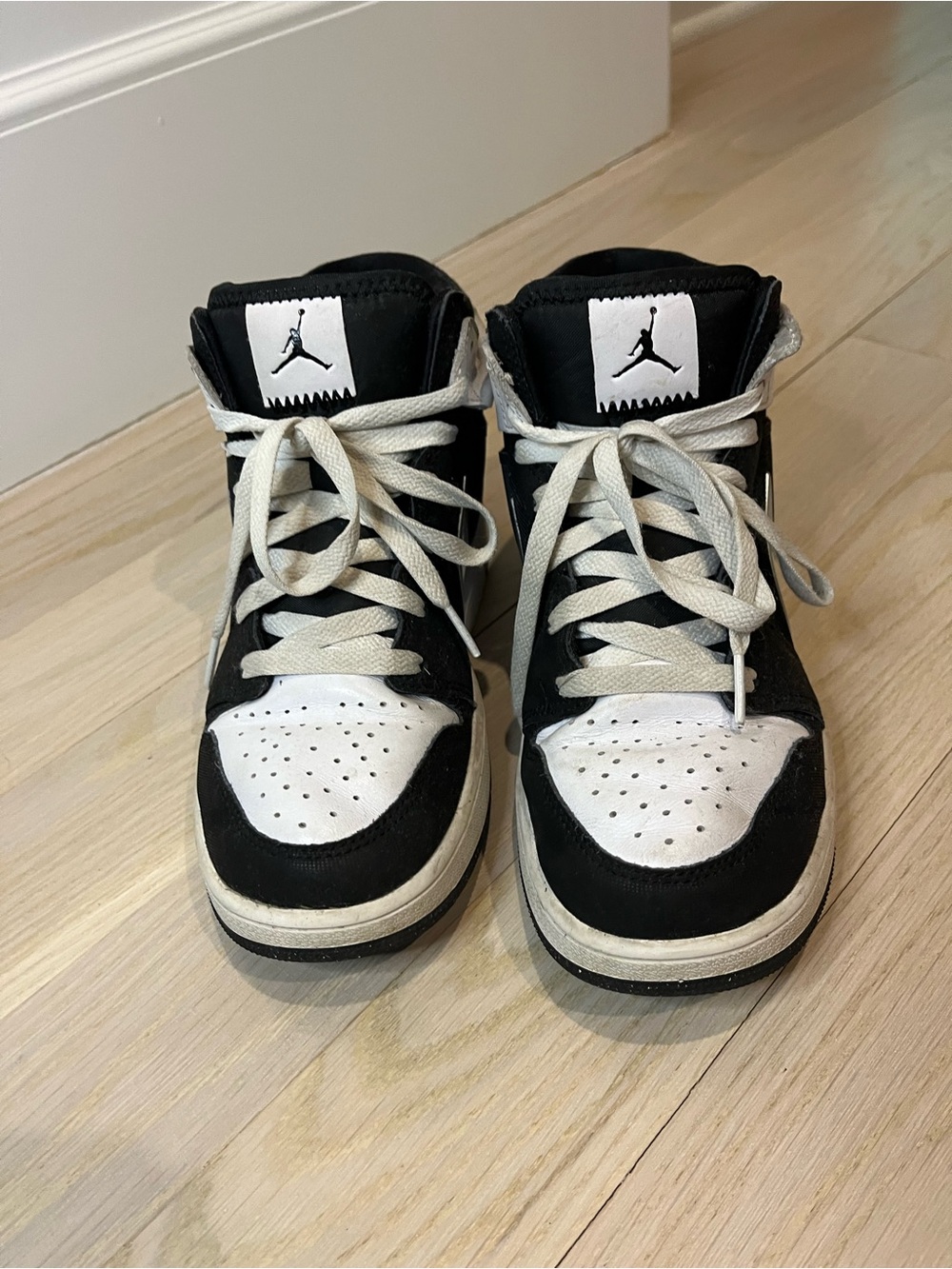 Jordan Kids Black and White High-Top Sneakers